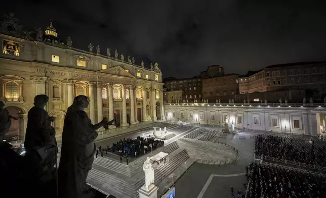 People attend a rosary prayer with Cardinal Victor Manuel Fernandez held for the health of Pope Francis in St Peter's Square at the Vatican, Friday, Feb. 28, 2025. (AP Photo/Andrew Medichini)