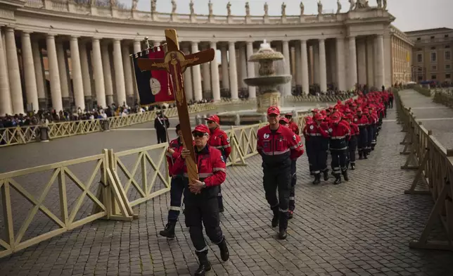 Italian Carabinieri civil protection volunteers arrive to St. Peter's Square at The Vatican, Saturday, March 8, 2025. (AP Photo/Francisco Seco)