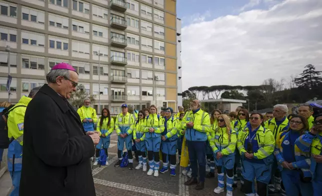 Bishop Franco Agostinelli leads a rosary prayer for Pope Francis in front of the Agostino Gemelli Polyclinic, in Rome, Saturday, March 8, 2025, where the Pontiff is hospitalized since Friday, Feb. 14. (AP Photo/Andrew Medichini)