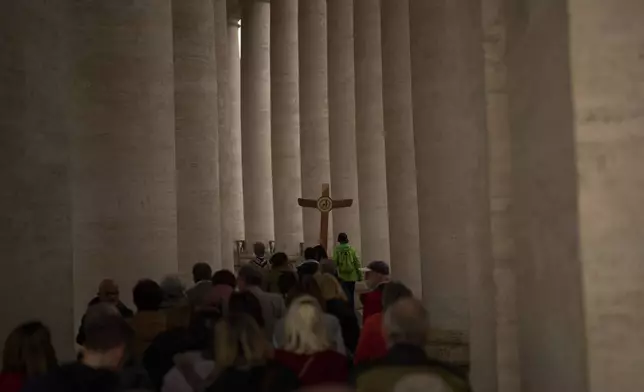 Catholic worshippers arrive to St. Peter's Square at The Vatican, Saturday, March 8, 2025. (AP Photo/Francisco Seco)