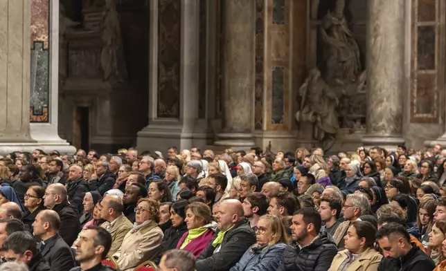 Catholic faithfuls attend a vigil rosary for the health of Pope Francis in St. Peter's Basilica at the Vatican, Saturday, March 1, 2025. (AP Photo/Mosa'ab Elshamy)