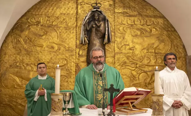 Faithful attend a Mass with the poor for the health of Pope Francis at an underground chapel under St. Peter's Basilica at the Vatican, Saturday, March 1, 2025. (AP Photo/Mosa'ab Elshamy)