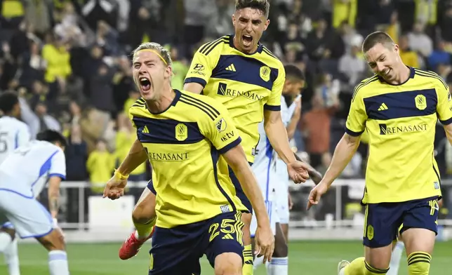 Nashville SC defender Walker Zimmerman (25), with midfielders Gastón Brugman, center, and Alex Muyl (19), celebrates a goal during the second half of an MLS soccer match against CF Montréal, Saturday, March 22, 2025, in Nashville, Tenn. (AP Photo/John Amis)