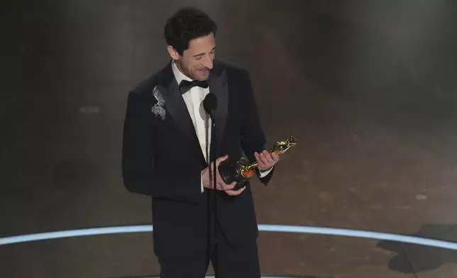 Adrien Brody accepts the award for best performance by an actor in a leading role for "The Brutalist" during the Oscars on Sunday, March 2, 2025, at the Dolby Theatre in Los Angeles. (AP Photo/Chris Pizzello)