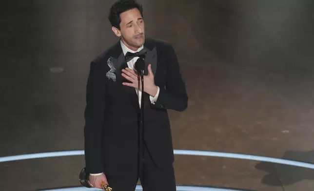 Adrien Brody accepts the award for best performance by an actor in a leading role for "The Brutalist" during the Oscars on Sunday, March 2, 2025, at the Dolby Theatre in Los Angeles. (AP Photo/Chris Pizzello)