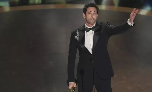 Adrien Brody accepts the award for best performance by an actor in a leading role for "The Brutalist" during the Oscars on Sunday, March 2, 2025, at the Dolby Theatre in Los Angeles. (AP Photo/Chris Pizzello)