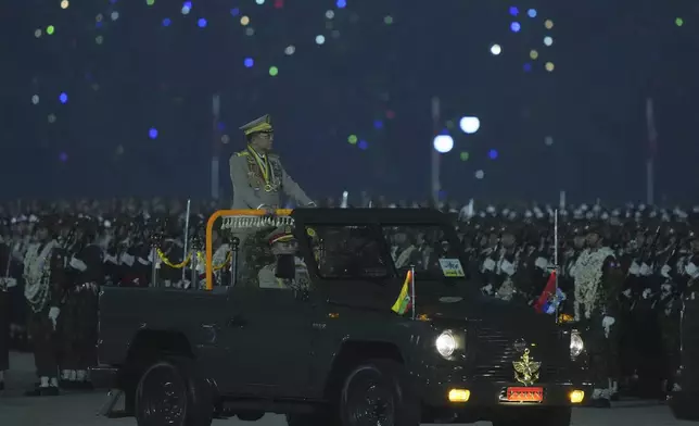 Senior Gen. Min Aung Hlaing, head of the military council, inspects officers during a parade to commemorate Myanmar's 80th Armed Forces Day, in Naypyitaw, Myanmar, Thursday, March 27, 2025. (AP Photo/Aung Shine Oo)