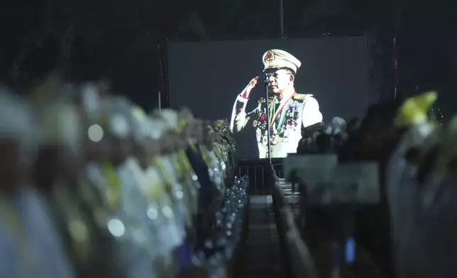 Senior Gen. Min Aung Hlaing, head of the military council, is seen on a screen during during a parade to commemorate Myanmar's 80th Armed Forces Day, in Naypyitaw, Myanmar, Thursday, March 27, 2025. (AP Photo/Aung Shine Oo)
