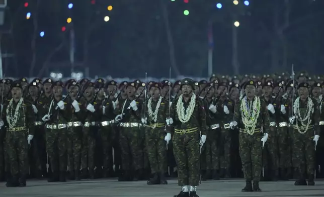 Myanmar military officers stand at attention during a parade to commemorate Myanmar's 80th Armed Forces Day, in Naypyitaw, Myanmar, Thursday, March 27, 2025. (AP Photo/Aung Shine Oo)