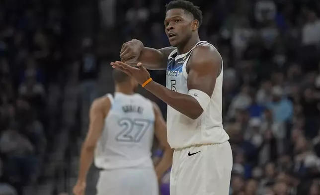 Minnesota Timberwolves guard Anthony Edwards (5) gestures after making a shot during the first half of an NBA basketball game against the Utah Jazz, Sunday, March 16, 2025, in Minneapolis. (AP Photo/Abbie Parr)