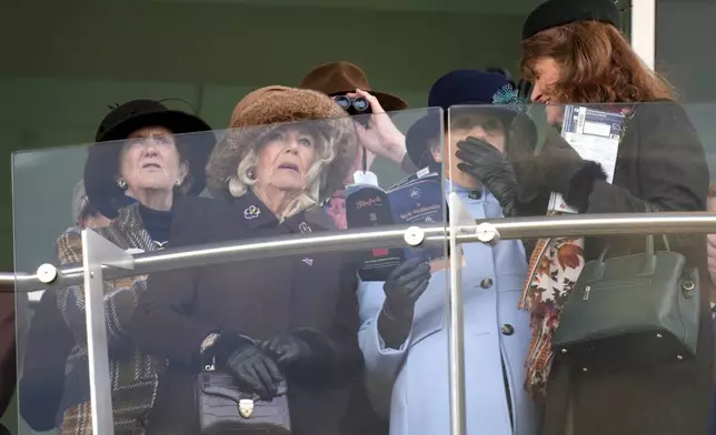 Britain's Queen Camilla, second left, watches the Queen Mother Champion Chase on day two of the 2025 Cheltenham Festival at Cheltenham Racecourse, England, Wednesday, March 12, 2025. (Andrew Matthews/PA via AP)