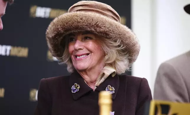 Britain' Queen Camilla in the parade ring after the Queen Mother Champion Chase on day two of the 2025 Cheltenham Festival at Cheltenham Racecourse, England, Wednesday, March 12, 2025. (Mike Egerton/PA via AP)