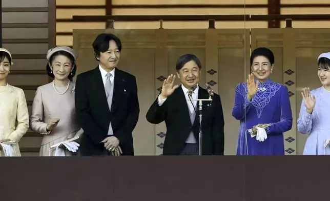 Japanese Emperor Naruhito, third right, accompanied by Empress Masako, second right, their daughter Princess Aiko, right, Crown Prince Akishino, third left, Crown Princess Kiko, second left, and Princess Kako, left, waves to well-wishers from the balcony of the Imperial Palace in Tokyo on the emperor's 65th birthday, Sunday, Feb. 23, 2025. (Kyodo News via AP)