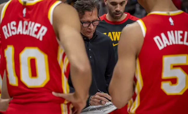 Atlanta Hawks head coach Quin Snyder sets the play during the first half of an NBA basketball game against the Los Angeles Clippers, Friday, March 14, 2025, in Atlanta. (AP Photo/Erik Rank)