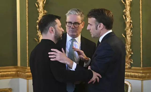 Britain's Prime Minister Keir Starmer, center, Ukraine's President Volodymyr Zelenskyy, left, and France's President Emmanuel Macron meet during the European leaders' summit to discuss Ukraine, hosted by Britain's Prime Minister Keir Starmer, at Lancaster House, London, Sunday March 2, 2025. (Justin Tallis/Pool via AP)