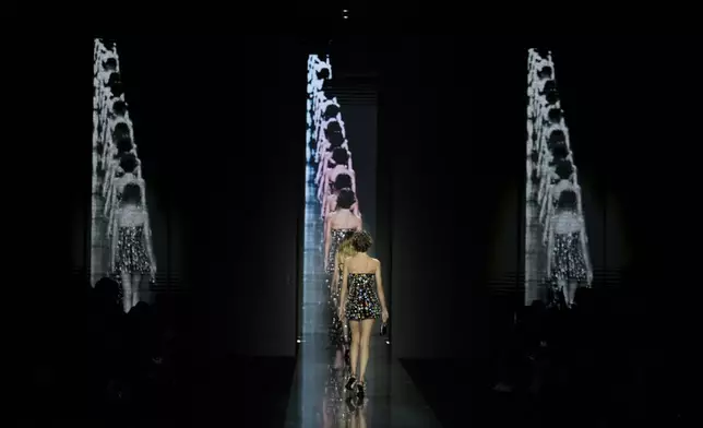 Models wear creations as part of the Dolce&amp;Gabbana's Fall/Winter 2025-2026 collection presented in Milan, Italy, Saturday, March 1, 2025. (AP Photo/Luca Bruno)