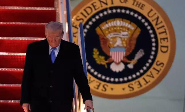 President Donald Trump walks down the stairs of Air Force One upon his arrival at Joint Base Andrews, Md., Sunday, March 9, 2025. (AP Photo/Luis M. Alvarez)