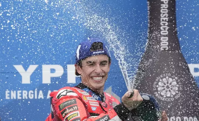 Spain's Marc Marquez of the Ducati Lenovo Team celebrates winning the MotoGP race in Termas de Rio Hondo circuit, Argentina, Sunday, March 16, 2025. (AP Photo/Gustavo Garello)