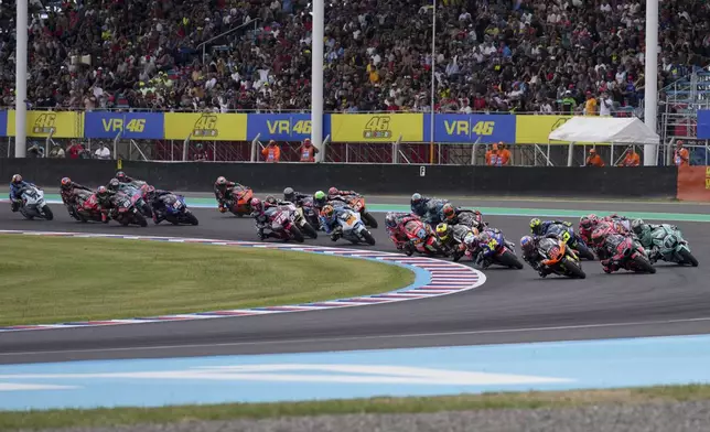 Riders speed at the start of the Moto2 race in Termas de Rio Hondo circuit, Argentina, Sunday, March 16, 2025. (AP Photo/Gustavo Garello)