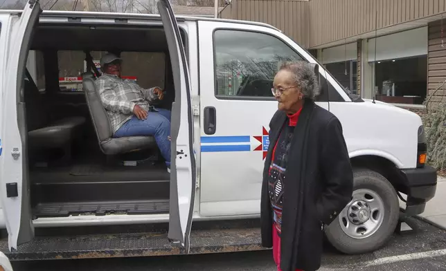 Mary Weaver, right, and Veronia Taylor get into a van as they leave the McDowell County Commission on Aging Senior Center in Welch, W.Va., Thursday, March 20, 2025. (AP Photo/Leah Willingham)