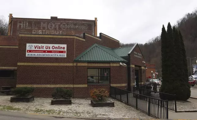 A sign outside the U.S. Social Security Administration advertises its online services in downtown Welch, W.Va., Thursday, March 20, 2025. (AP Photo/Leah Willingham)