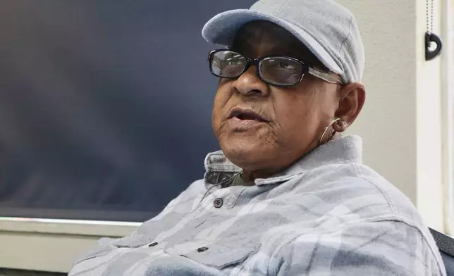 Veronica Taylor talks about how changes to the Social Security Administration's identity verification process will impact people in rural areas while eating lunch at the McDowell County Commission on Aging Senior Center in Welch, W.Va., Thursday, March 20, 2025. (AP Photo/Leah Willingham)