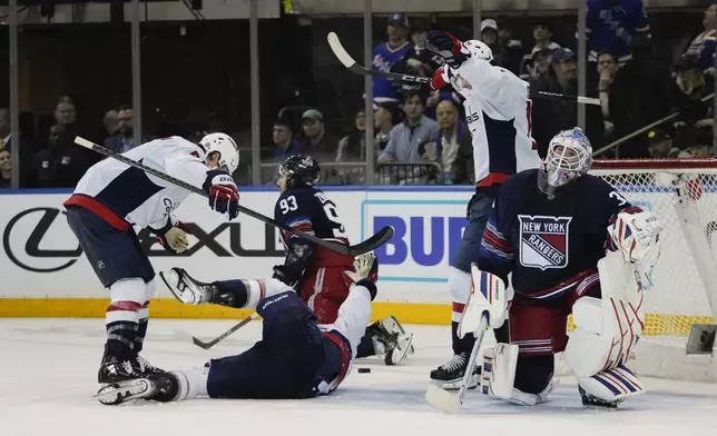 New York Rangers goaltender Igor Shesterkin (31) reacts as the Washington Capitals celebrate a goal by Tom Wilson during the overtime period of an NHL hockey game Wednesday, March 5, 2025, in New York. (AP Photo/Frank Franklin II)