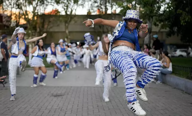 Dancers from the "Ilusiones de Palermo" group perform during Carnival celebrations in Buenos Aires, Argentina, Tuesday, March 4, 2025. (AP Photo/Natacha Pisarenko)