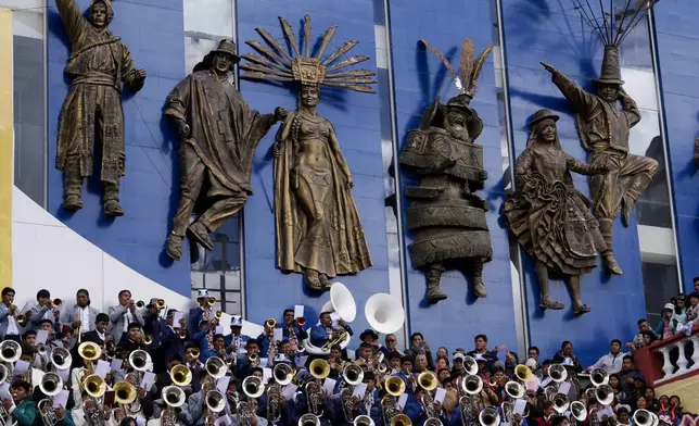 Band musicians perform during a pre-carnival celebration in Oruro, Bolivia, Saturday, Feb. 22, 2025. (AP Photo/Juan Karita)