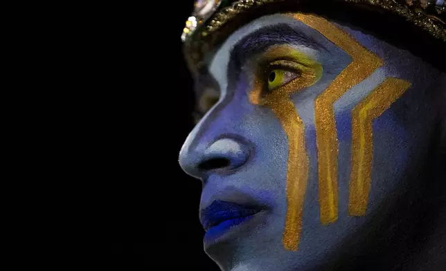 An artist prepares for Carnival celebrations at the Sambadrome in Rio de Janeiro, Monday, March 3, 2025. (AP Photo/Bruna Prado)