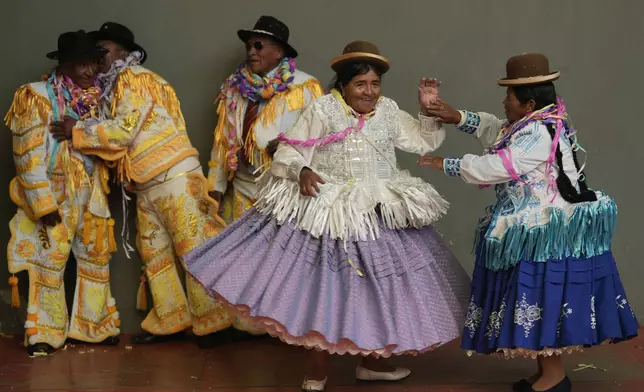 Contestants vying to represent Chola and Chuta for Carnival dance during an election ceremony, in El Alto, Bolivia, Wednesday, Feb. 19, 2025. (AP Photo/Juan Karita)