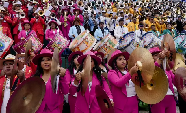 Band musicians perform in a pre-carnival celebration in Oruro, Bolivia, Saturday, Feb. 22, 2025. (AP Photo/Juan Karita)