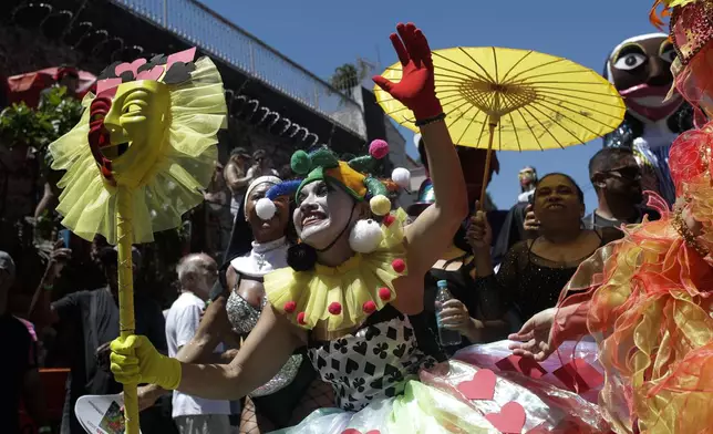 Revelers attend the Carmelitas street party on the first official day of Carnival in Rio de Janeiro, Friday, Feb. 28, 2025. (AP Photo/Bruna Prado)