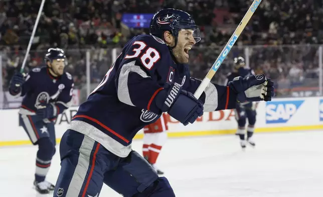 Columbus Blue Jackets' Boone Jenner celebrates their goal against the Detroit Red Wings during the second period of the Stadium Series NHL hockey game at Ohio Stadium, Saturday, March 1, 2025, in Columbus, Ohio. (AP Photo/Jay LaPrete)