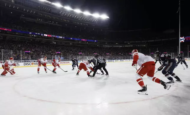 The Detroit Red Wings and the Columbus Blue Jackets play during the second period of the Stadium Series NHL hockey game at Ohio Stadium, Saturday, March 1, 2025, in Columbus, Ohio. (AP Photo/Jay LaPrete)