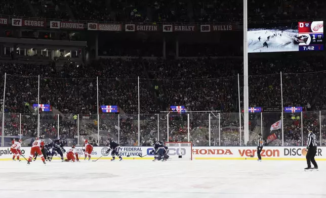 The Detroit Red Wings and the Columbus Blue Jackets play during the second period of the Stadium Series NHL hockey game at Ohio Stadium, Saturday, March 1, 2025, in Columbus, Ohio. (AP Photo/Jay LaPrete)