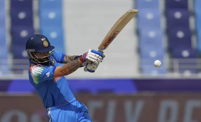 India's Virat Kohli plays a shot during the ICC Champions Trophy cricket match between India and New Zealand at Dubai International Cricket Stadium in Dubai, United Arab Emirates, Sunday, March 2, 2025. (AP Photo/Altaf Qadri)