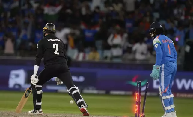 New Zealand's Will O'Rourke is bowled out by India's Kuldeep Yadav during the ICC Champions Trophy cricket match between India and New Zealand at Dubai International Cricket Stadium in Dubai, United Arab Emirates, Sunday, March 2, 2025. (AP Photo/Altaf Qadri )