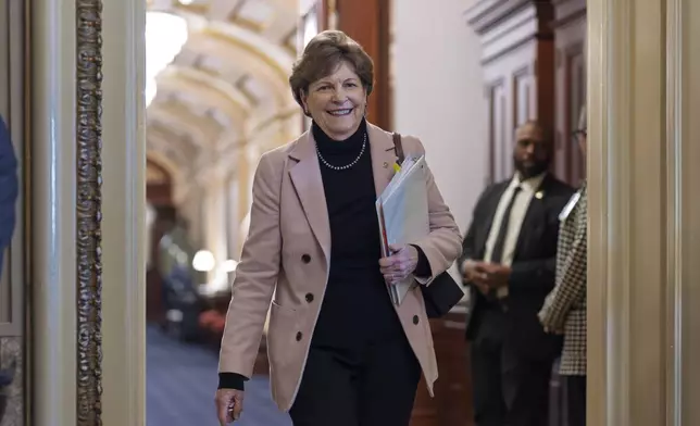 Sen. Jeanne Shaheen, D-N.H., heads to a closed-door meeting with fellow Democrats on mounting a response to the Republican-led spending bill that already passed the House, Thursday, March 13, 2025, in Washington. (AP Photo/J. Scott Applewhite)
