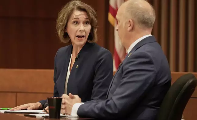 Wisconsin Supreme Court candidates Brad Schimel and Susan Crawford participate in a debate Wednesday, March 12, 2025, in Milwaukee. (AP Photo/Morry Gash)