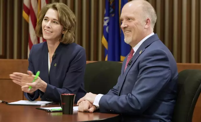 Wisconsin Supreme Court candidates Brad Schimel and Susan Crawford are seen before a debate Wednesday, March 12, 2025, in Milwaukee. (AP Photo/Morry Gash)