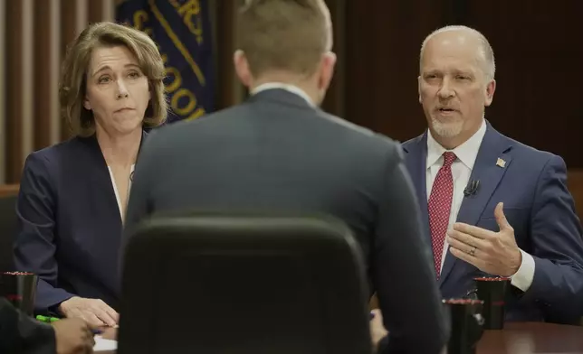 Wisconsin Supreme Court candidates Brad Schimel and Susan Crawford participate in a debate Wednesday, March 12, 2025, in Milwaukee. (AP Photo/Morry Gash)