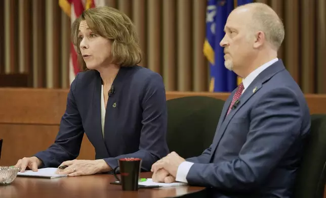 Wisconsin Supreme Court candidates Brad Schimel and Susan Crawford participate in a debate Wednesday, March 12, 2025, in Milwaukee. (AP Photo/Morry Gash)
