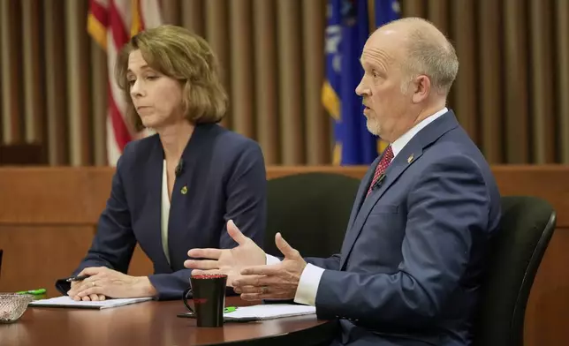 Wisconsin Supreme Court candidates Brad Schimel and Susan Crawford participate in a debate Wednesday, March 12, 2025, in Milwaukee. (AP Photo/Morry Gash)