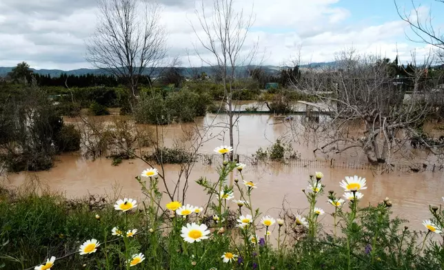 Farmland and properties are photographed flooded after heavy rains in Malaga, Spain, Tuesday, March 18, 2025. (AP Photo/Gregorio Marrero)