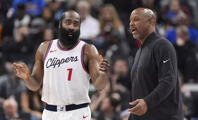 Los Angeles Clippers guard James Harden, left, talks with acting head coach Brian Shaw during the second half of an NBA basketball game against the Sacramento Kings, Sunday, March 9, 2025, in Inglewood, Calif. (AP Photo/Mark J. Terrill)