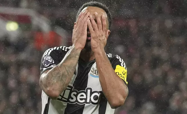 Newcastle's Callum Wilson reacts after missing a chance during the English Premier League soccer match between Liverpool and Newcastle United at Anfield in Liverpool, Wednesday, Feb. 26, 2025. (AP Photo/Jon Super)