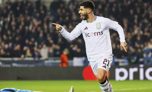 Aston Villa's Marco Asensio celebrates after an own goal by Brugge's Brandon Mechele made it past Brugge's goalkeeper Simon Mignolet during the Champions League round of 16 first leg soccer match between Club Brugge and Aston Villa at the Jan Breydel Stadium in Bruges, Belgium, Tuesday, March 4, 2025. (AP Photo/Geert Vanden Wijngaert)