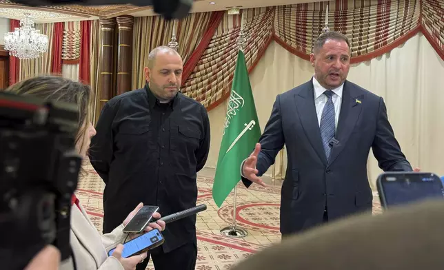 Ukrainian Head of Presidential Office Andriy Yermak, right, and Ukrainian Minister of Defense Rustem Umerov speak to journalists in Jeddah, Saudi Arabia, Tuesday, March 11, 2025. (AP Photo/Baraa Anwer)