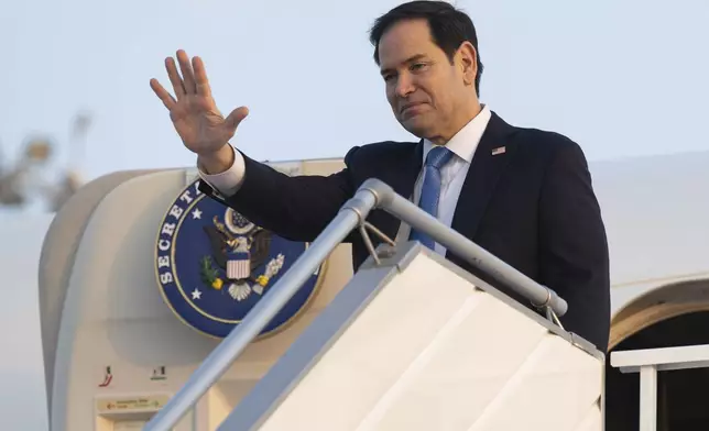 US Secretary of State Marco Rubio boards a military airplane prior to departing from King Abdulaziz International Airport in Jeddah, Saudi Arabia, Wednesday, March 12, 2025, as he travels to Canada for a G7 Foreign Ministers meeting. (Saul Loeb/Pool Photo via AP)